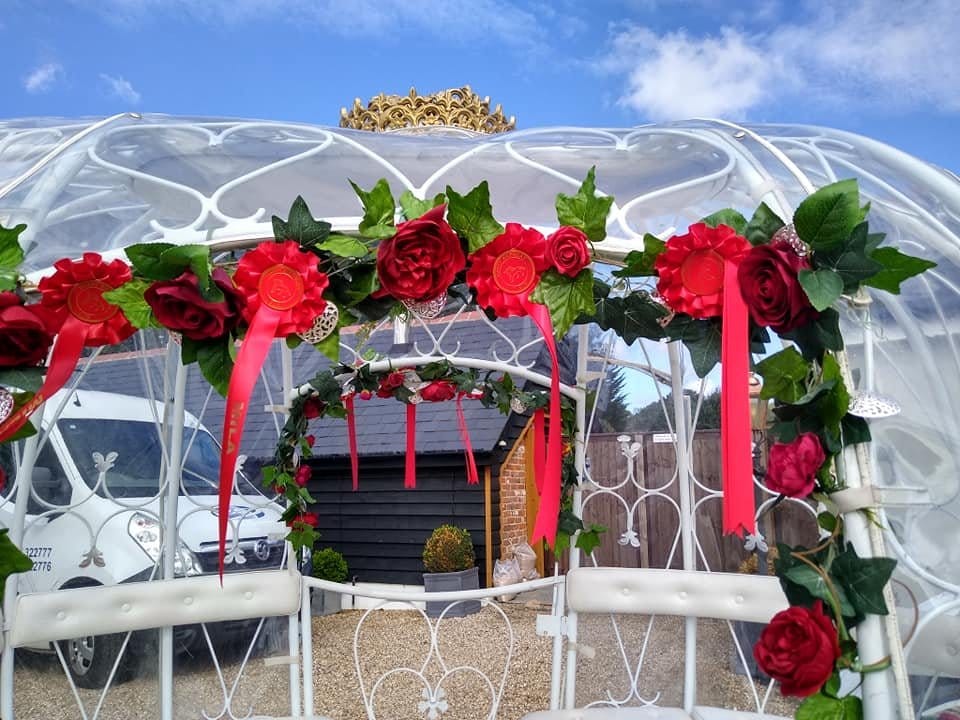 The Cinderella carriage decorated with red roses