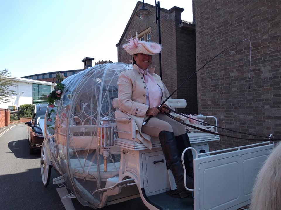 The Cinderella carriage with its coachman